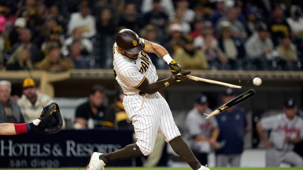 Sep 24, 2021; San Diego, CA, USA; San Diego Padres first baseman Eric Hosmer (30) breaks his bat against the Atlanta Braves during the seventh inning at Petco Park. Mandatory Credit: Ray Acevedo-USA TODAY Sports